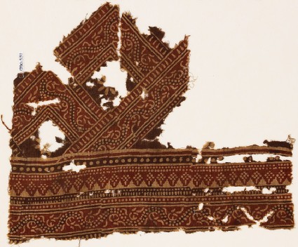 Textile fragment with bands of dotted patterns and vinefront