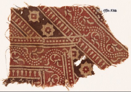 Textile fragment with bands of dotted vines, rosettes, and diamond-shapesfront