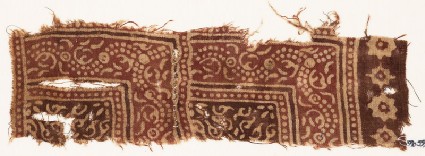 Textile fragment with dotted vine and stylized tendrilsfront
