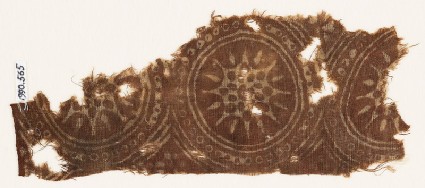 Textile fragment with star-shaped flowers in dotted circlesfront
