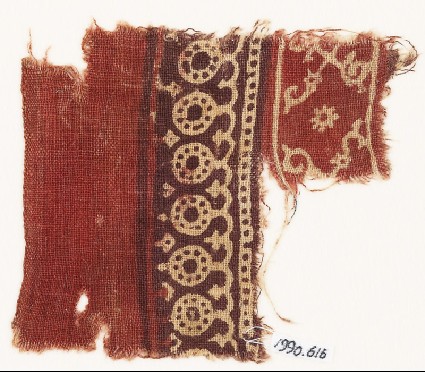Textile fragment with bands of dotted circles, curves, and crossed tendrilsfront