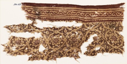 Textile fragment with tendrils arranged as medallions, rosettes, and a vinefront