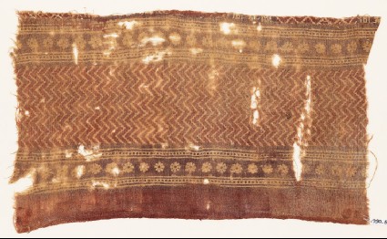 Textile fragment with chevrons and rosettesfront