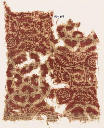 Textile fragment with interlocking circles, flower-heads, and tendrilsfront