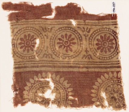 Textile fragment with rosettes in dotted circlesfront