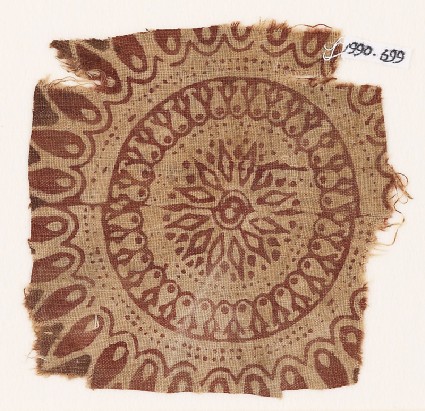 Textile fragment with an elaborate rosette, circles, and petalsfront