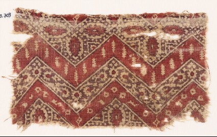 Textile fragment with chevrons, hexagons, and flowersfront