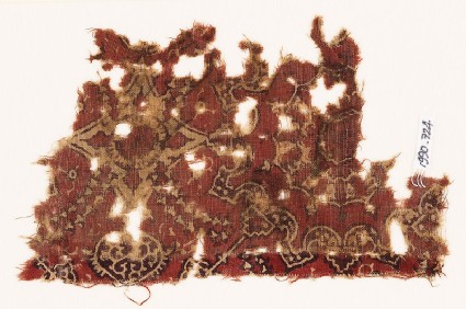 Textile fragment with medallion and linked floral designfront
