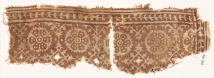 Textile fragment with rosettes and four-pointed starsfront