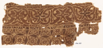 Textile fragment with interlace and four-pointed starsfront