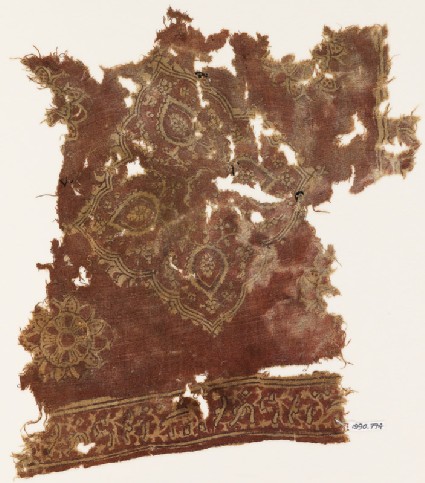 Textile fragment with floral medallion and Persian-style scriptfront