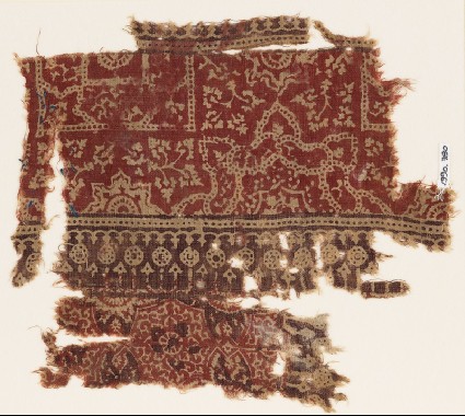 Textile fragment with half-medallions, squares, and plantsfront