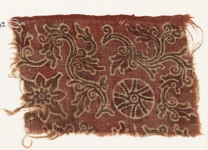 Textile fragment with curving vines, quatrefoil, and rosettefront