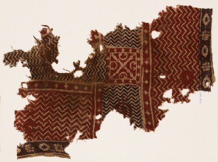 Textile fragment with chevrons and a squarefront