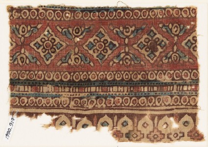 Textile fragment with diamond-shapes, circles, and archesfront