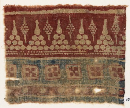 Textile fragment with dots arranged as trianglesfront