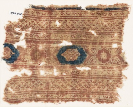 Textile fragment with bands of crosses and medallionsfront