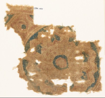 Textile fragment with part of a large rosettefront