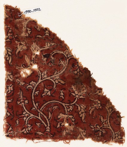 Textile fragment with stylized plants and stemsfront