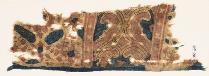 Textile fragment with curving tendrilsfront
