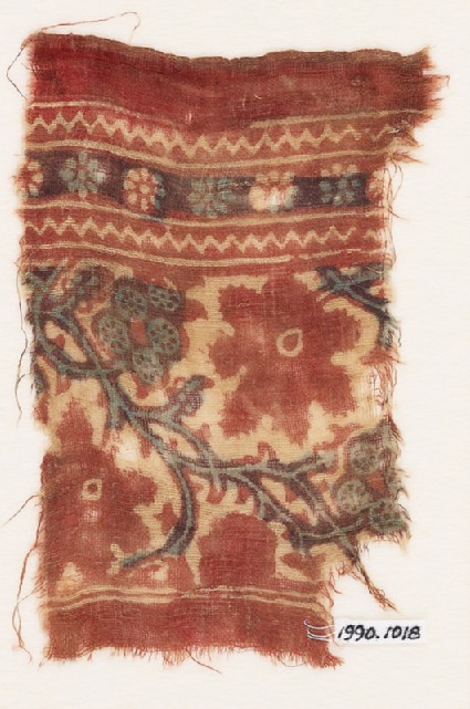 Textile fragment with tendrils, vine leaves, and flowers or fruitfront