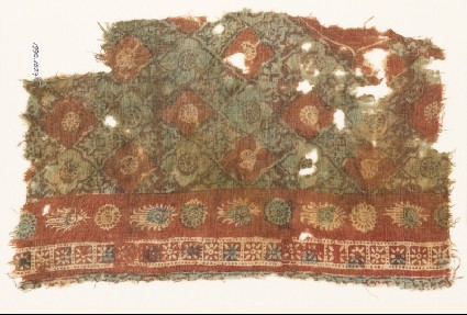 Textile fragment with grid of quatrefoils and serrated crossesfront