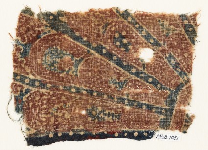 Textile fragment with part of a large rosette medallionfront