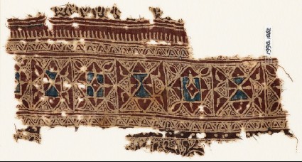 Textile fragment with interlocking squares and trianglesfront