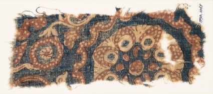 Textile fragment with tendrils, circles, and flowerfront