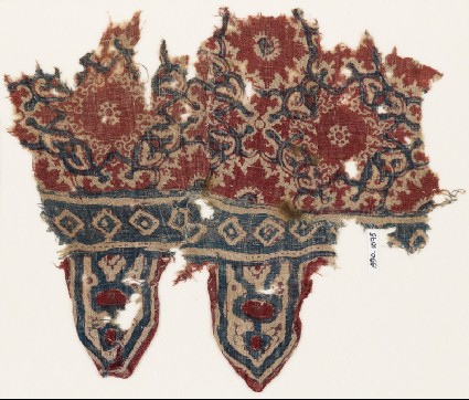 Textile fragment with medallions, interlace, and tabsfront