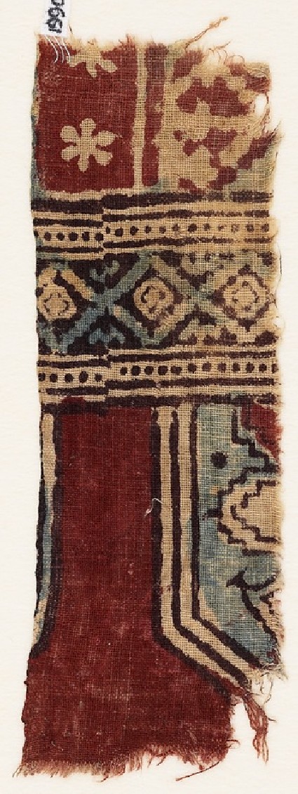 Textile fragment with part of a tab, cartouche, and plantfront