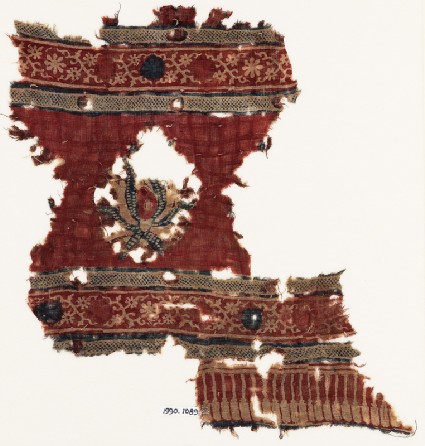 Textile fragment with large flower and crossed tendrilsfront