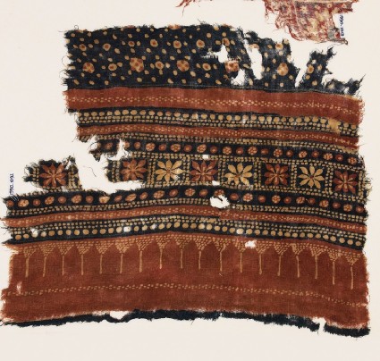 Textile fragment with bands of flowers and dotsfront