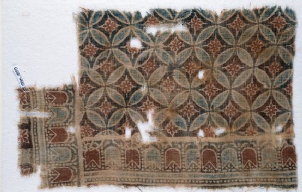 Textile fragment with linked circles and rosettesfront