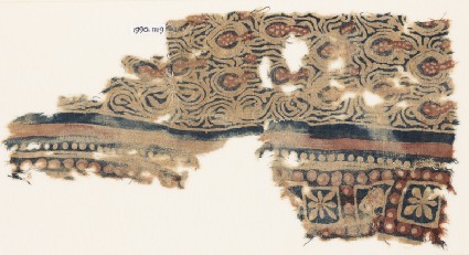 Textile fragment with stylized plants and squaresfront