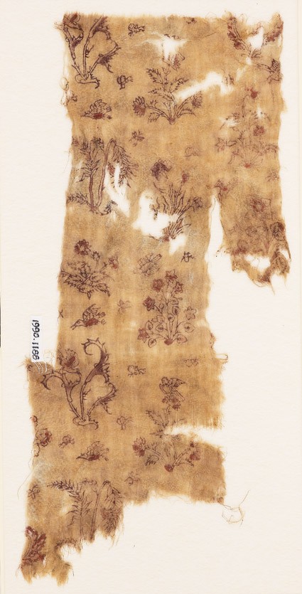 Textile fragment with flowering plants, birds, and insectsfront