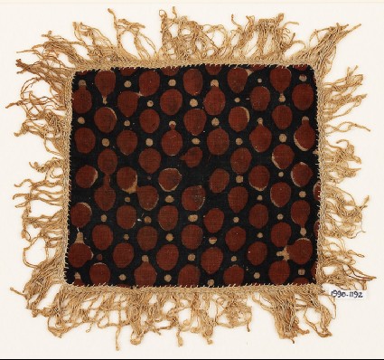 Textile fragment with dots and fringe, possibly from a place-mat or jar coverfront