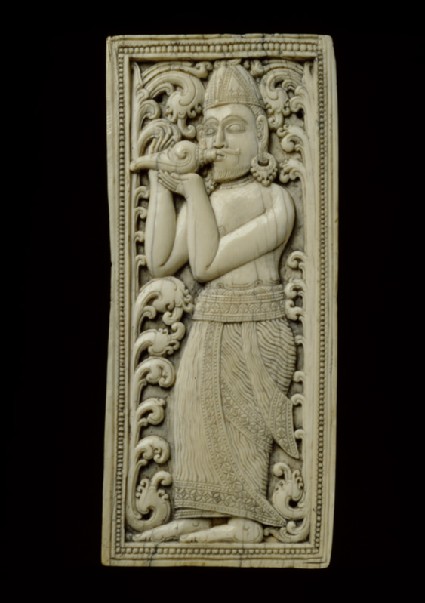 Ivory plaque with conch-blowerfront
