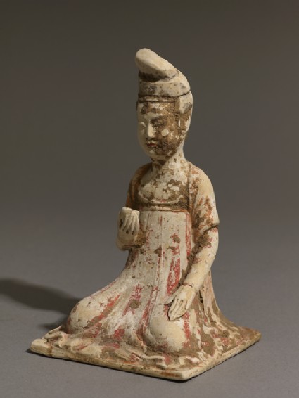 Seated figure of a lady holding a cupoblique