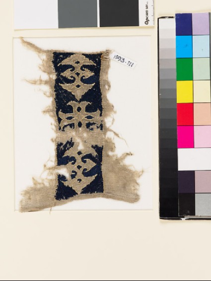 Textile fragment with cross and double palmettesfront