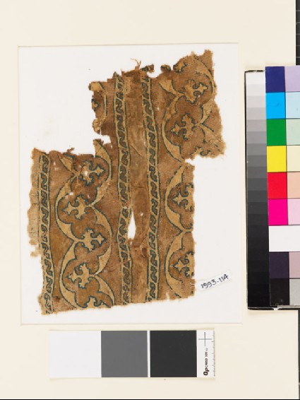 Textile fragment with bands of curving lines and floral trefoilsfront