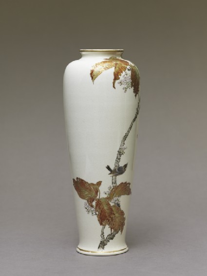 Satsuma style vase depicting a bird perched on a cherry treeside
