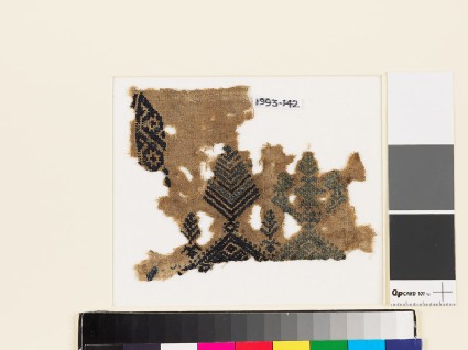 Textile fragment with stylized trees and birdsfront