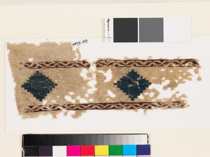 Textile fragment with stepped diamond-shapes and latticefront
