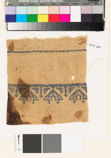 Textile fragment with stylized birds and treesfront