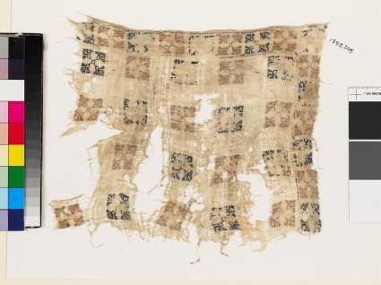 Textile fragment with squares and flower-headsfront