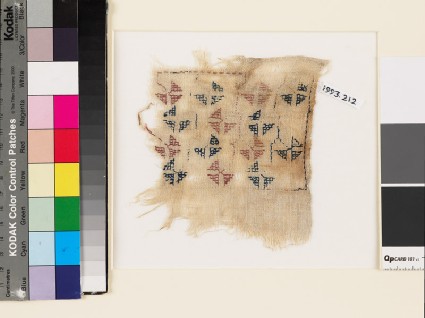 Textile fragment with geometric flowers and stemsfront