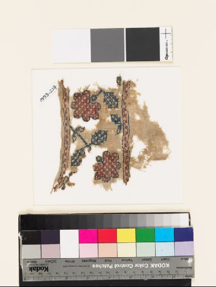 Textile fragment with stylized flowers, leaves, and squaresfront