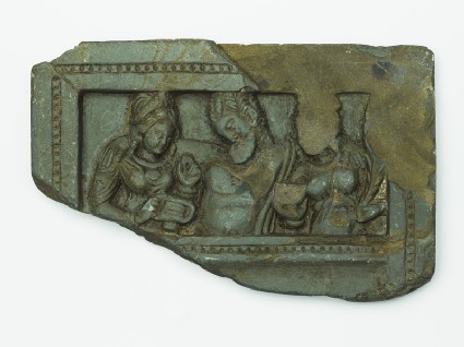 Lid or palette with the drunken Heracles supported by two female attendantstop