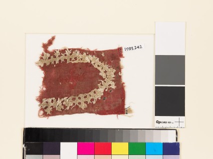Textile fragment with shield-shape of linked crossesfront